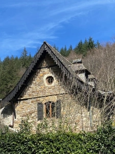 Authentic Auvergne mill on the banks of a stream.