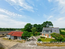PROPERTY COMPRISING A HOUSE, A 360 M² SHED, NUMEROUS OUTBUILDINGS AND 6,280 M² OF LAND – SET IN NATURAL SURROUNDINGS IN KERFOURN, NEAR PONTIVY
