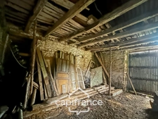 Stone house with outbuildings and large grounds – Wooded and quiet setting – La Motte (22600)