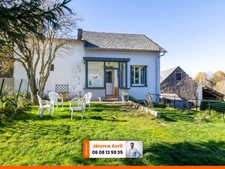 Maison avec terrain à Nébouzat, 88 m² habitable, véranda et garage.