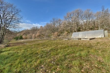 Maison dans un environnement boisé