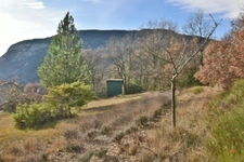Maison dans un environnement boisé