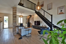 Renovated 100 m² house with a double garage, garden, and terraces