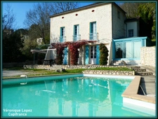 AGEN near the center, beautiful stone house with 7 rooms, veranda, swimming pool, dovecote, large garage on land of 3,951.00 m²