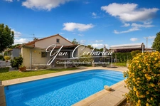 Maison familiale de plain-pied avec véranda, garage et piscine
