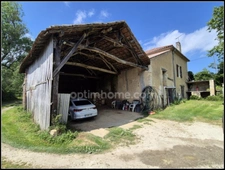Maison en pierre avec dépendances, piscine, et terrain à Saint Puy
