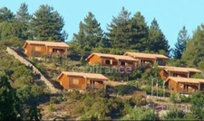 Dpt Corse (20), à vendre EVISA, ensemble de six chalets en bois avec terrasse sur terrain avec piscine et parking 
