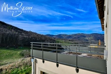 Sur les hauteurs de Thurins - Plateau de 100m² en duplex à aménager avec terrasse, 2 stationnements et 1 cave 