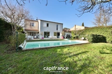 Maison 8 pièces TASSIN LE BOURG (69) de 157m² avec piscine, sous sol et garage - Parcelle de 817m²