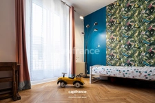 APPARTEMENT DE STYLE HAUSSMANNIEN D'EXCEPTION AVEC GRANDE PIÈCE À VIVRE DE PLUS DE 70M2