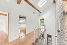 PRÉVESSIN-MOËNS – Ancienne forge du XIXᵉ transformée en loft – 187 m² – 3 chambres – Jardin