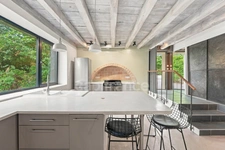 PRÉVESSIN-MOËNS – Ancienne forge du XIXᵉ transformée en loft – 187 m² – 3 chambres – Jardin