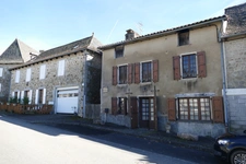 Maison en pierre avec petit jardin proche commerces et services (Puycapel-Calvinet, 15)