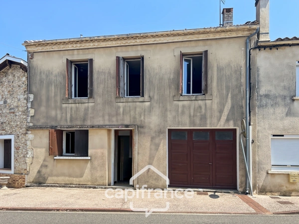 Maison à renover avec fort potentiel, cour et garage