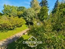 Maison avec 3 chambres, garage et jardin, proches commerces et écoles