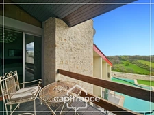 Maison d'architecte en pierre 200m², vue dégagée plein sud, piscine,lumineuse ,commodités à pied, 25min Agen, 20 min Golfech