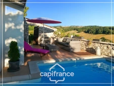 Maison d'architecte en pierre 200m², vue dégagée plein sud, piscine,lumineuse ,commodités à pied, 25min Agen, 20 min Golfech
