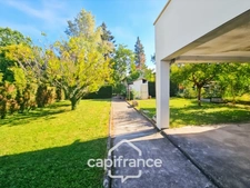 Maison avec 3 chambres, garage et jardin, proches commerces et écoles