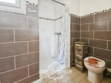 Maison avec 3 chambres, garage et jardin, proches commerces et écoles