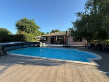 BIGANOS – Quartier recherché du VIGNEAU – Élégante propriété de 190 m² sur un magnifique terrain paysager de 2 370 m² avec piscine, dépendance et double garage