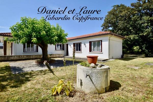 Maison de plain-pied - 4 chambres - garage - terrain clos 