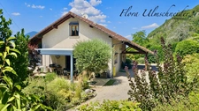 Maison familiale d'environ 135 m² avec vue panoramique, au cœur d'un écrin de verdure à CHANAZ (73). À seulement 25 minutes d'Aix-les-Bains, 45 minutes de Chambéry et 50 minutes d'Annecy.