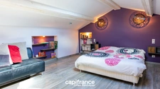 Maison 172 m² habitables, 187 m² au sol, sur un terrain arboré de 1 395 m² en Zone U.