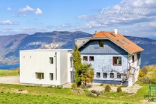 Large house for sale in Ontex (73) with building land. 20 minutes from Chindrieux, 40 minutes from Aix-les-Bains, 1 hour 30 minutes from Geneva. Views of Lake Bourget and Mont Blanc.