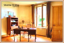 Ensemble immobilier avec une maison, 2 appartements loués, 2 garages, 3 ateliers à Chabreloche.