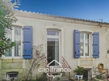 Single-storey house for sale in SAINT JEAN D'ANGELY (17) with 3 rooms, garden and garage, close to shops