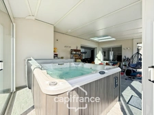 Maison contemporaine de plain-pied de 160 m² – 4 chambres – Véranda de 27 m² avec spa – Double garage – Carport – Noyal-Pontivy