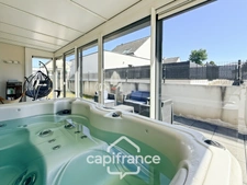 Maison contemporaine de plain-pied de 160 m² – 4 chambres – Véranda de 27 m² avec spa – Double garage – Carport – Noyal-Pontivy
