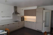 In the center of Montrevel-en-Bresse, a bright 2-bedroom apartment with balcony, top floor and garage – in a recent building 