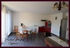 In the center of Montrevel-en-Bresse, a bright 2-bedroom apartment with balcony, top floor and garage – in a recent building 